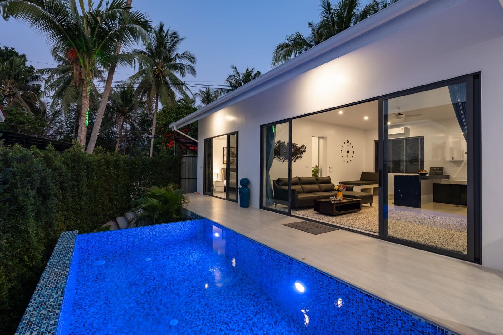Three Bedroom Villa evening pool terrace and living room glow